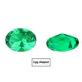 Columbia green cultivated emerald gemstones showing various cuts including round, heart, and princess shapes