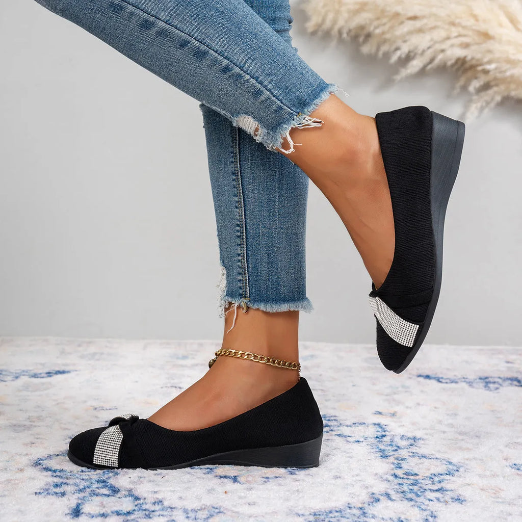 Black women's slip-on casual shoes with a chunky heel and rhinestone details on the fabric upper.