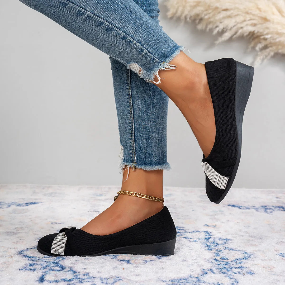 Black women's slip-on casual shoes with a chunky heel and rhinestone details on the fabric upper.