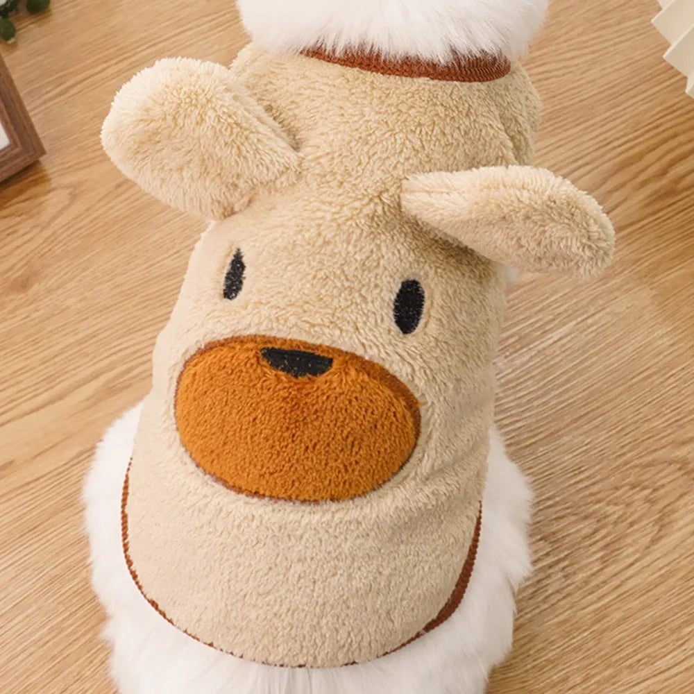 Fleece-lined warm polyester dog coat in cream with bear ears, lying flat showing size tag