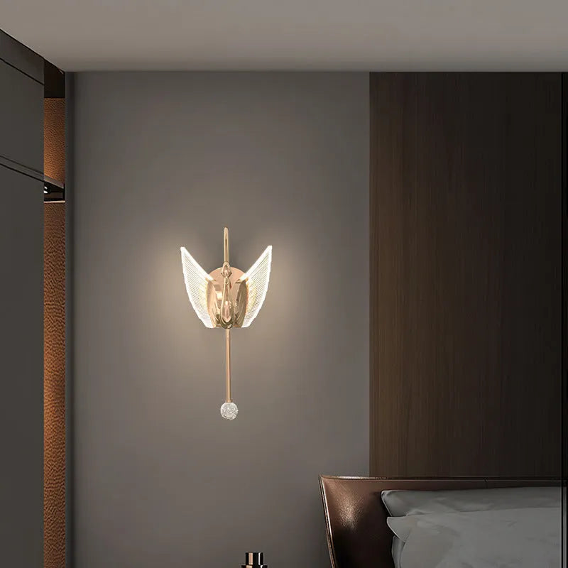 Gold swan-shaped LED wall lamp with acrylic shade and iron construction for bedroom lighting