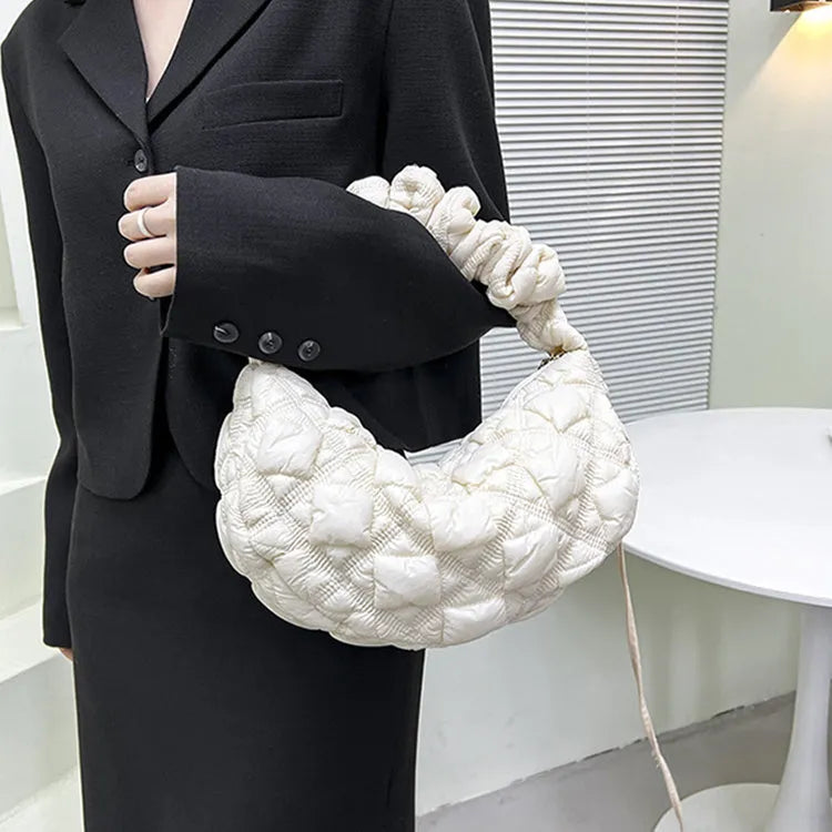 Beige nylon women's casual shoulder messenger bag with a long strap, shown from the side.