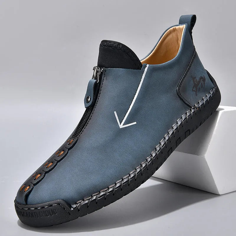 Men's black leather zip-up Martin boots with hand-stitched detail and a round toe.