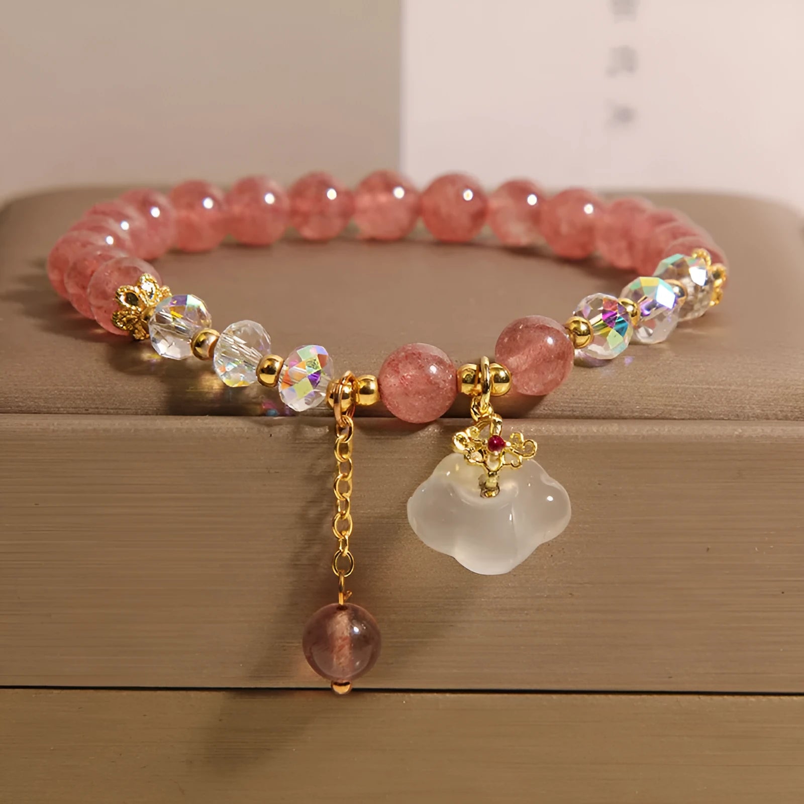 Women's strawberry quartz and white agate crystal bracelet with auspicious cloud charms