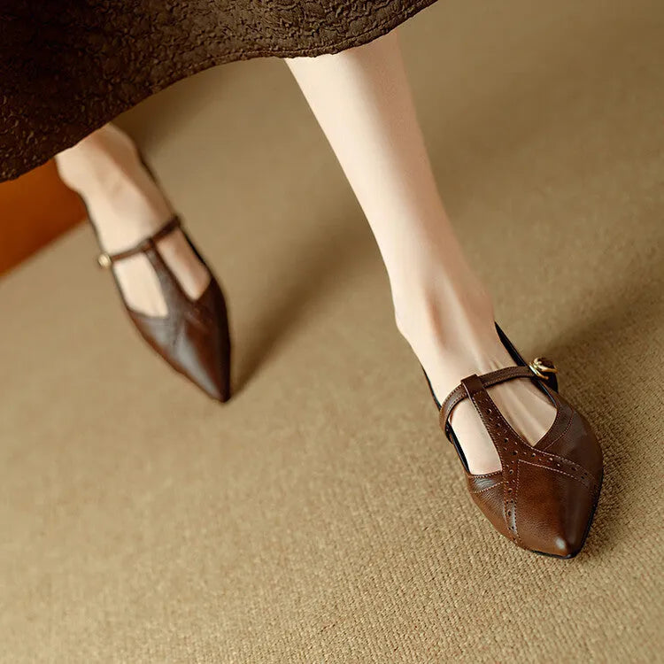 Brown women's cowhide leather low-cut flat shoes with a round toe and soft bottom.