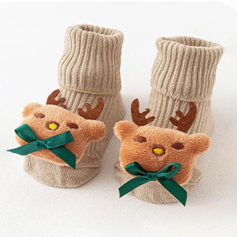 Cotton baby floor socks in blue bow pattern for infants 0-3 months.