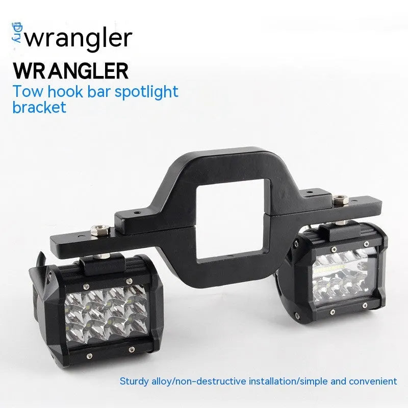 Black aluminium alloy LED reverse light mounting bracket for a Jeep Wrangler off-road vehicle.