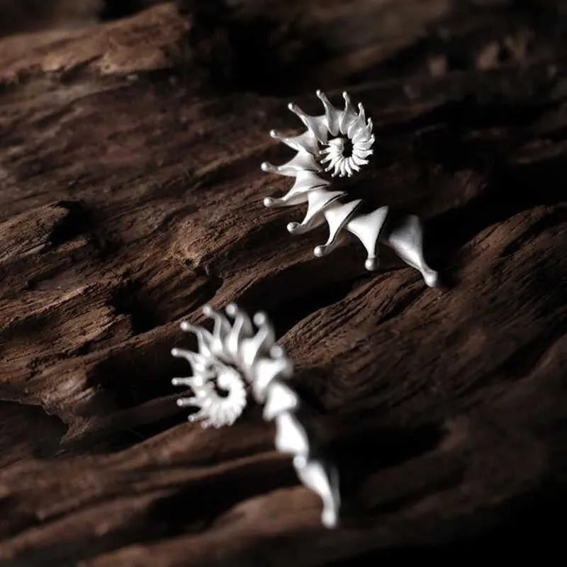 Exaggerated three-dimensional conch shell design matte earrings in alloy with electroplated finish