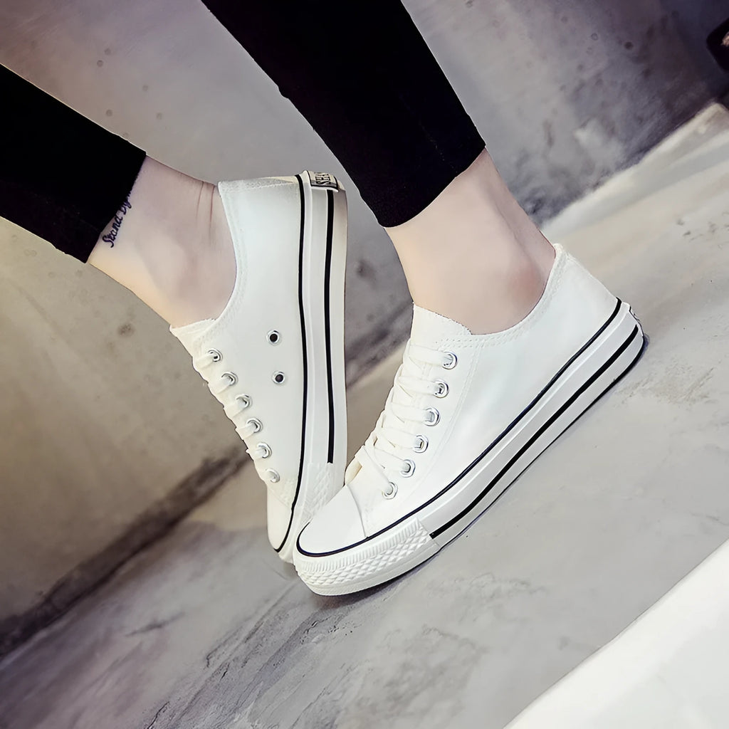 Women's solid colour canvas summer shoes available in black, white black, white red, and all black colour options.