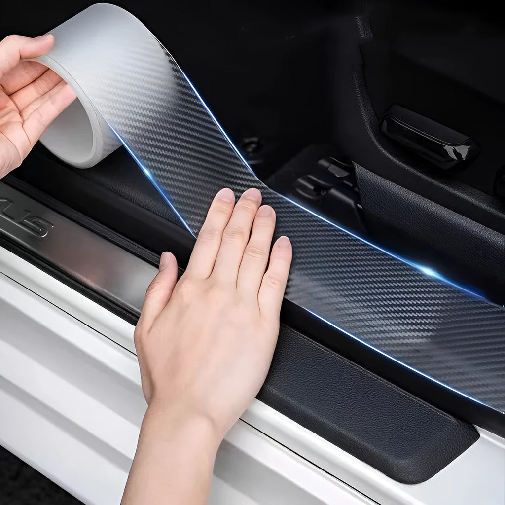 Carbon fibre grain anti-collision strip on a roll with scraper and utility knife for car door protection.