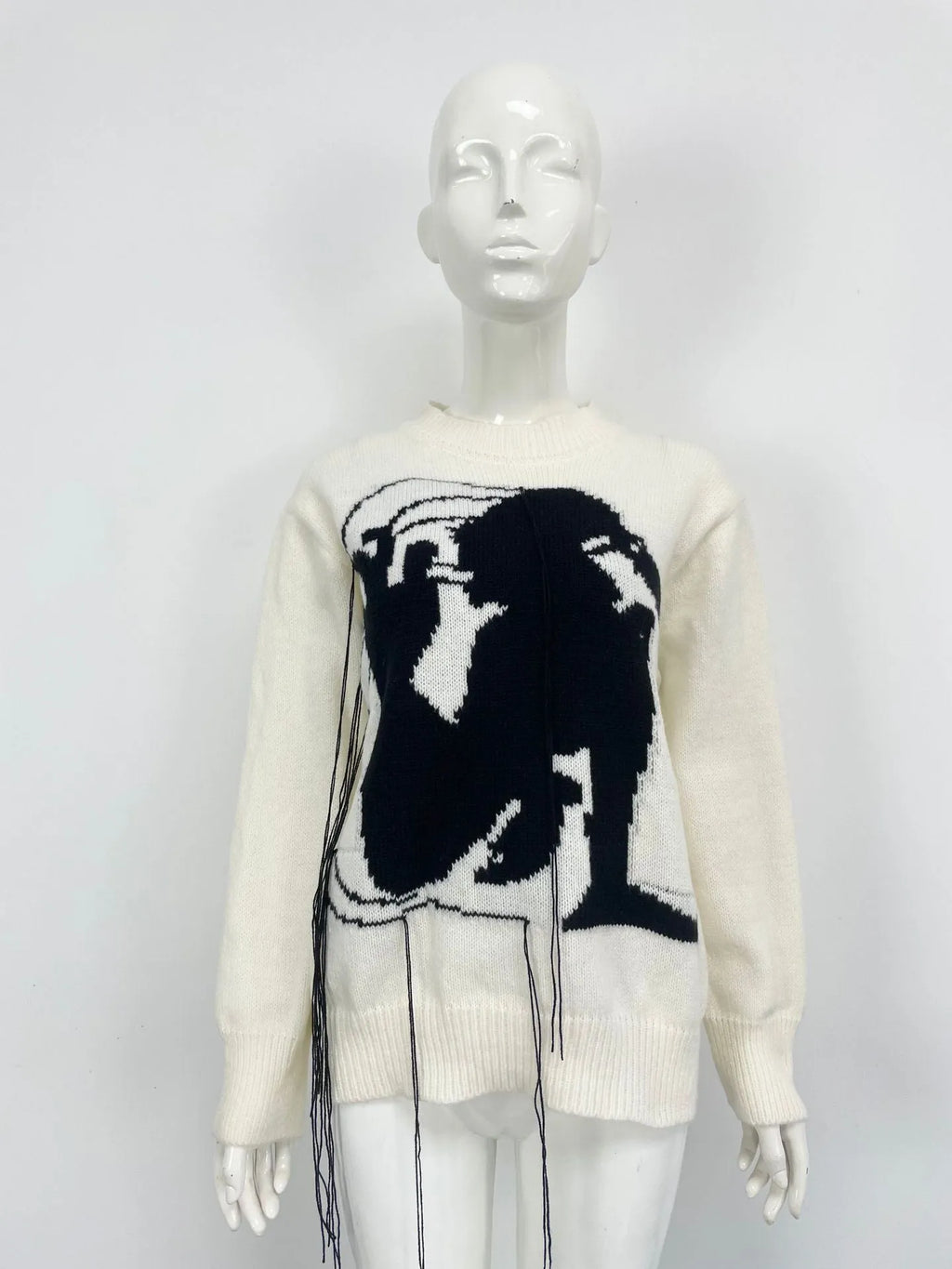 Women's loose grey alpaca wool sweater with tassel design and abstract pattern