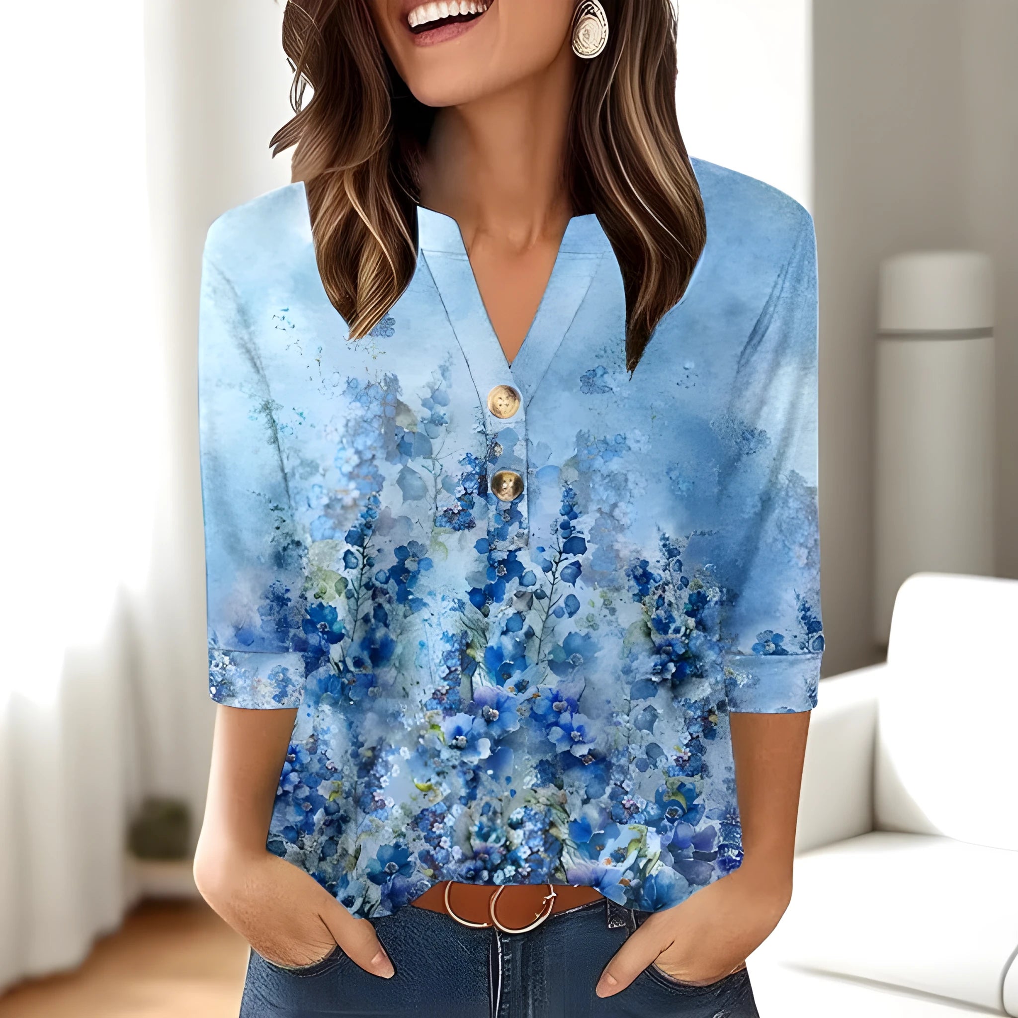 Women's loose fit V-neck t-shirt with a colourful 3D printed pattern, on a hanger.