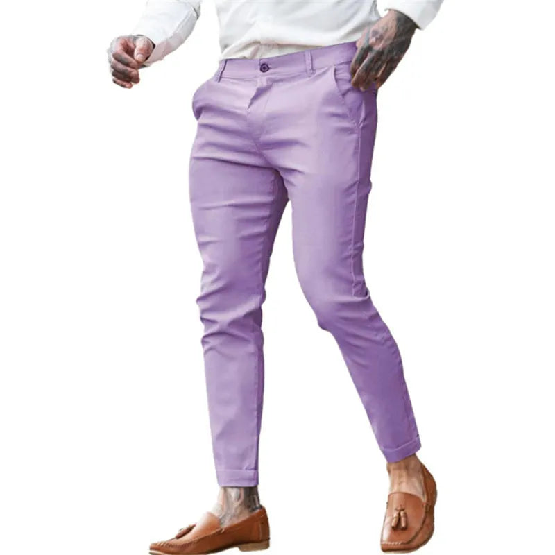 Men's slim-fit pencil trousers in high elasticity cotton twill fabric on a grey background.