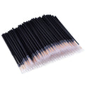 Pack of 100 black disposable eyeliner brushes with fine points and plastic sleeves.