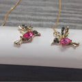 Personalised bird hanging earrings with zirconium wing detail and zodiac animal modelling in long drop style