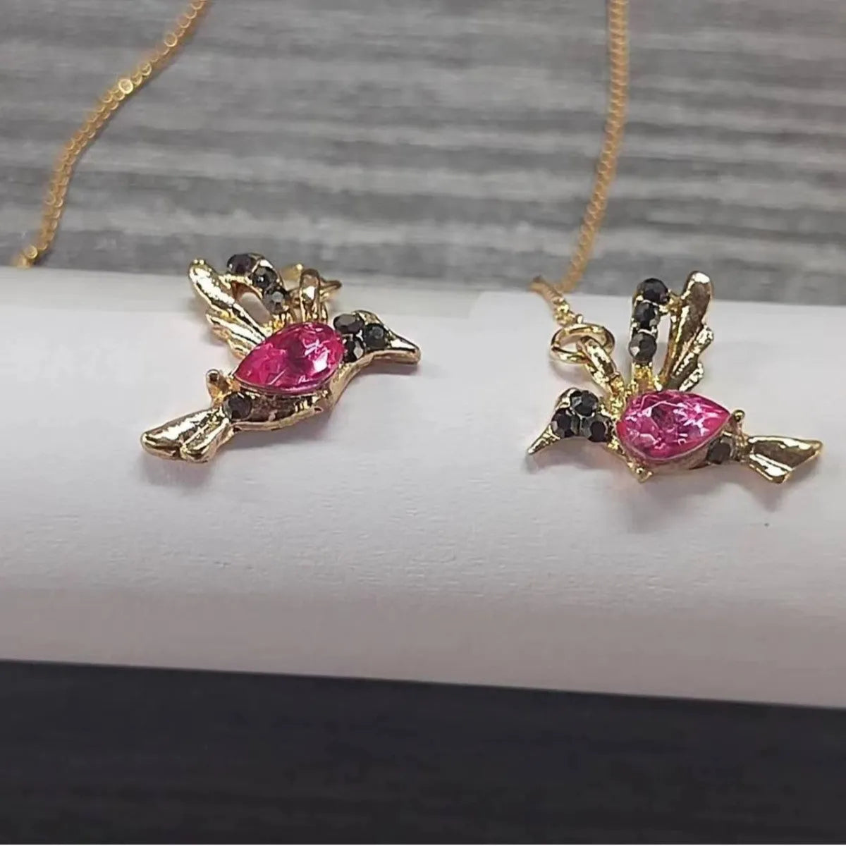 Personalised bird hanging earrings with zirconium wing detail and zodiac animal modelling in long drop style