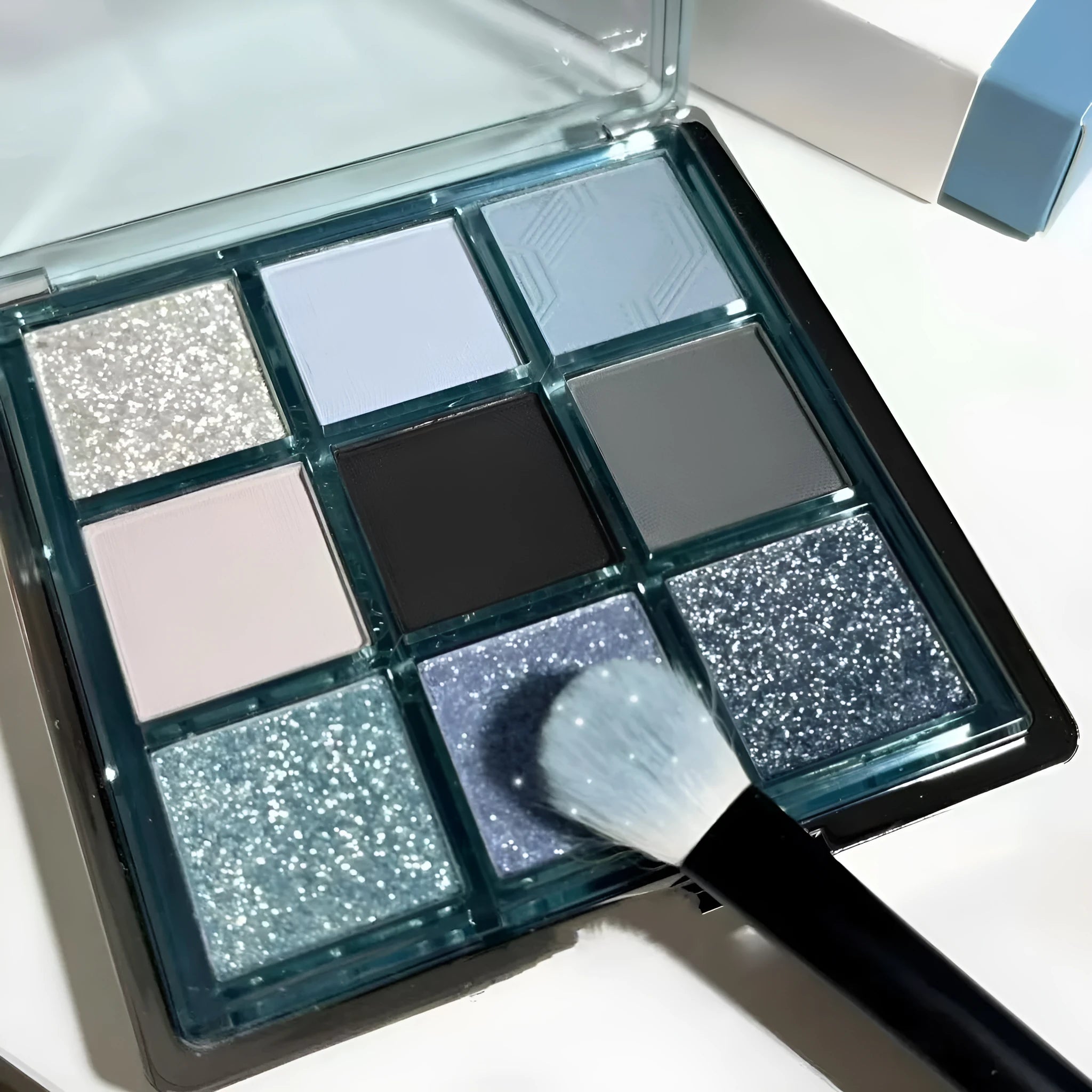 Mugeleen nine-colour eye shadow palette 08 with blue smoked design showing matte and shimmer finishes