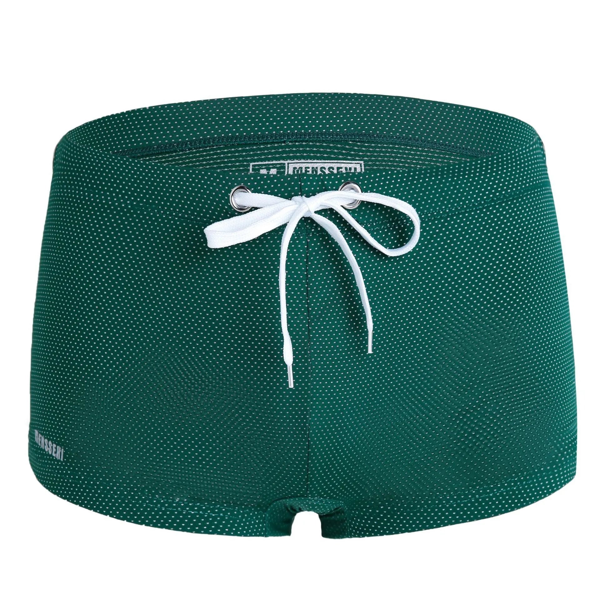 Men's solid colour nylon boxer swimming trunks with a low waist design on a white background.