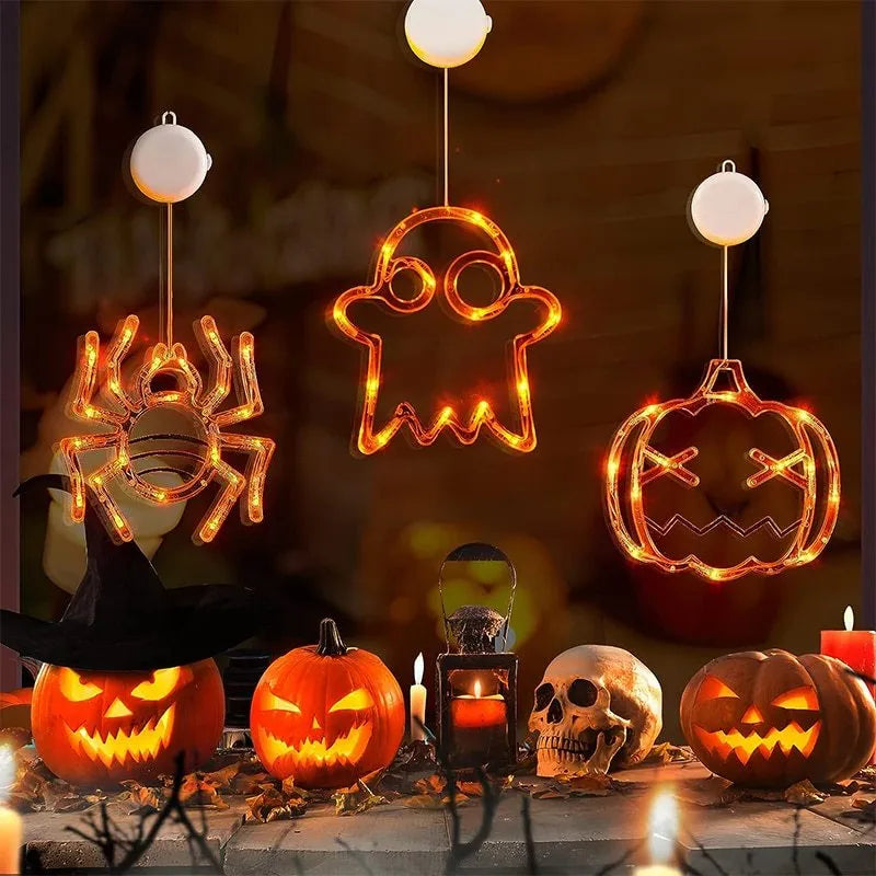 Halloween window hanging LED lights 7-piece set with spider pumpkin ghost designs on display