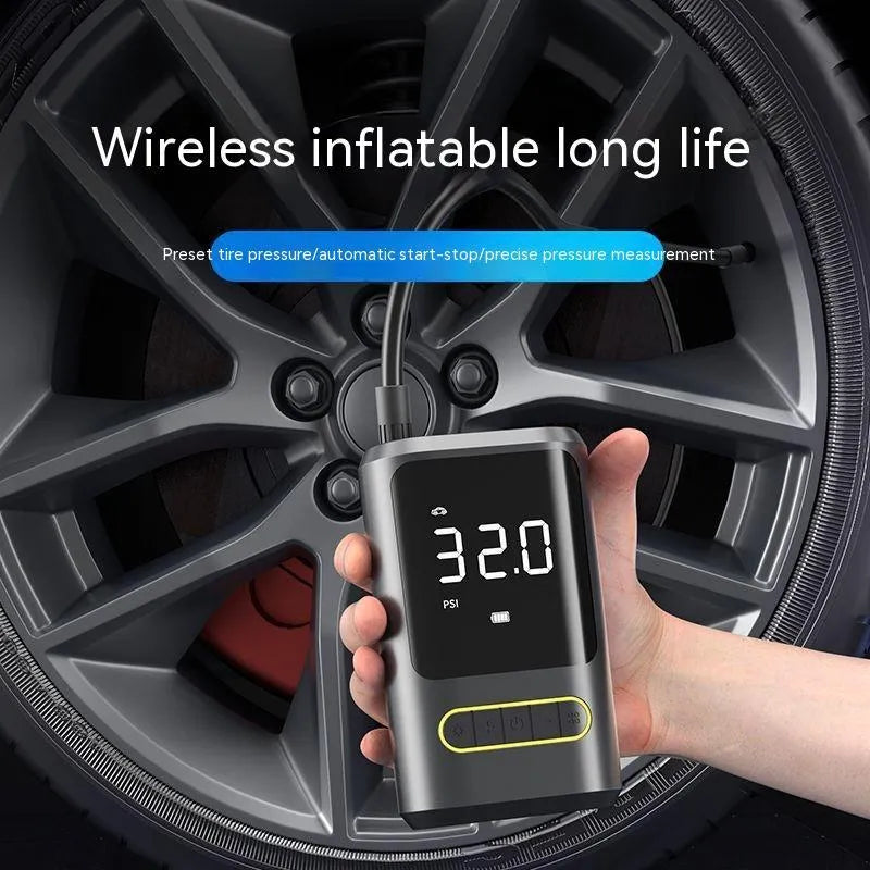 Black handheld digital wireless tyre inflator pump with LED light display on a grey background.