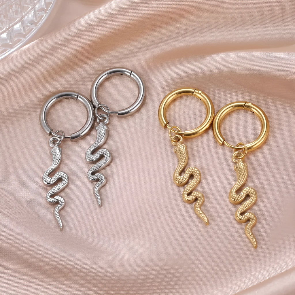 Vintage snake-shaped stainless steel earrings with gold plating in an ear clip design.