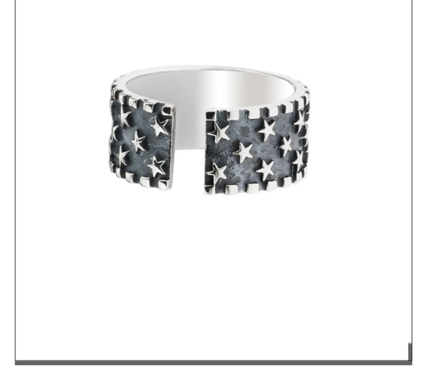 Adjustable opening sterling silver ring with a geometric pattern of several five-pointed stars.