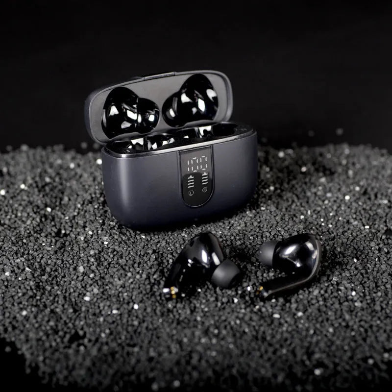 Jerry X08 black wireless in-ear headphones with digital display next to their USB charging case.