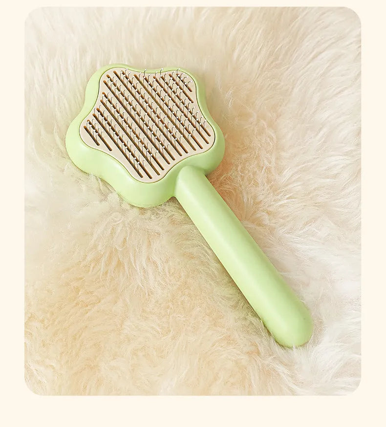 Green self-cleaning cat comb magic wand with stainless steel needles for pet grooming