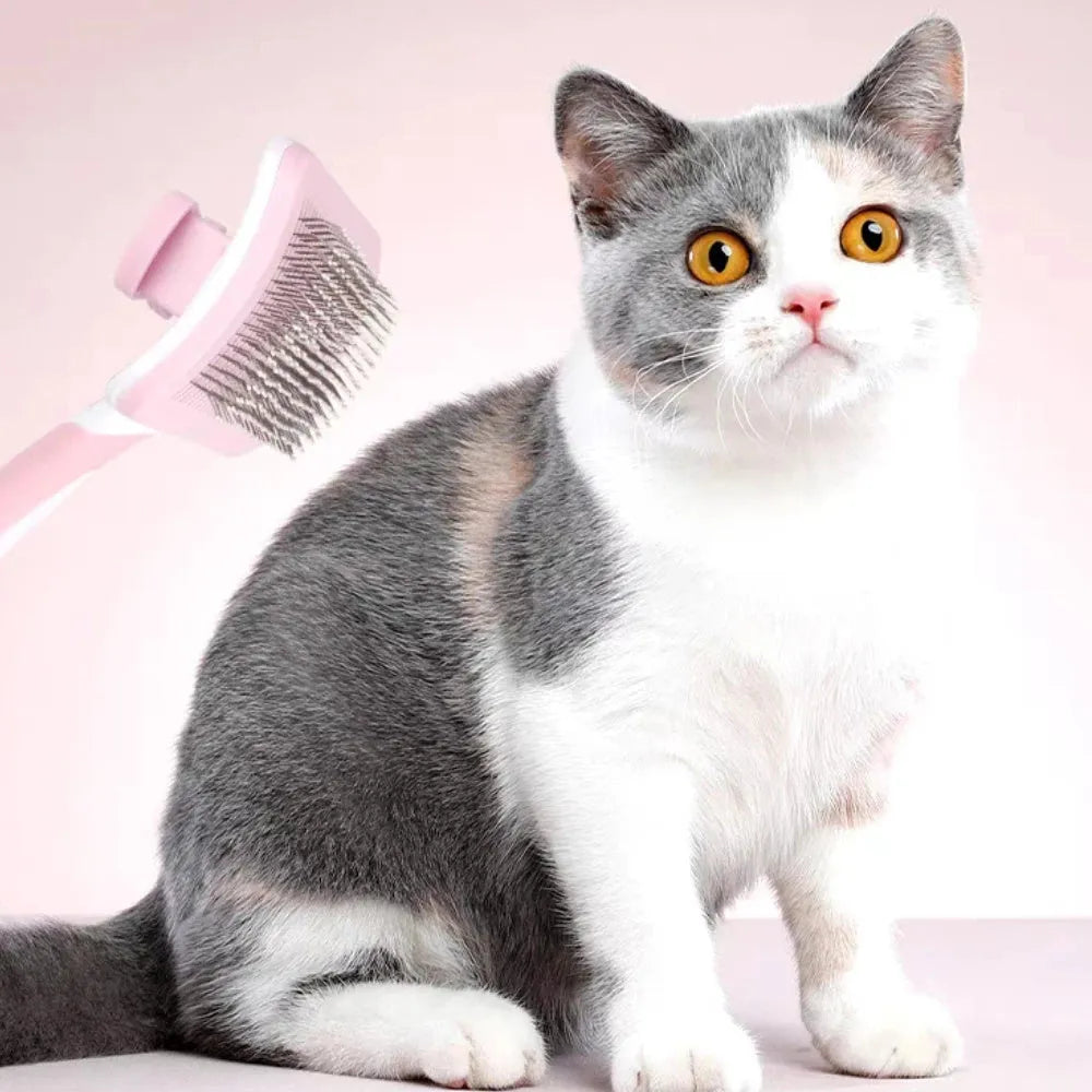Self-cleaning slicker brush for dogs and cats with one-click hair removal button, available in green, orange, and pink