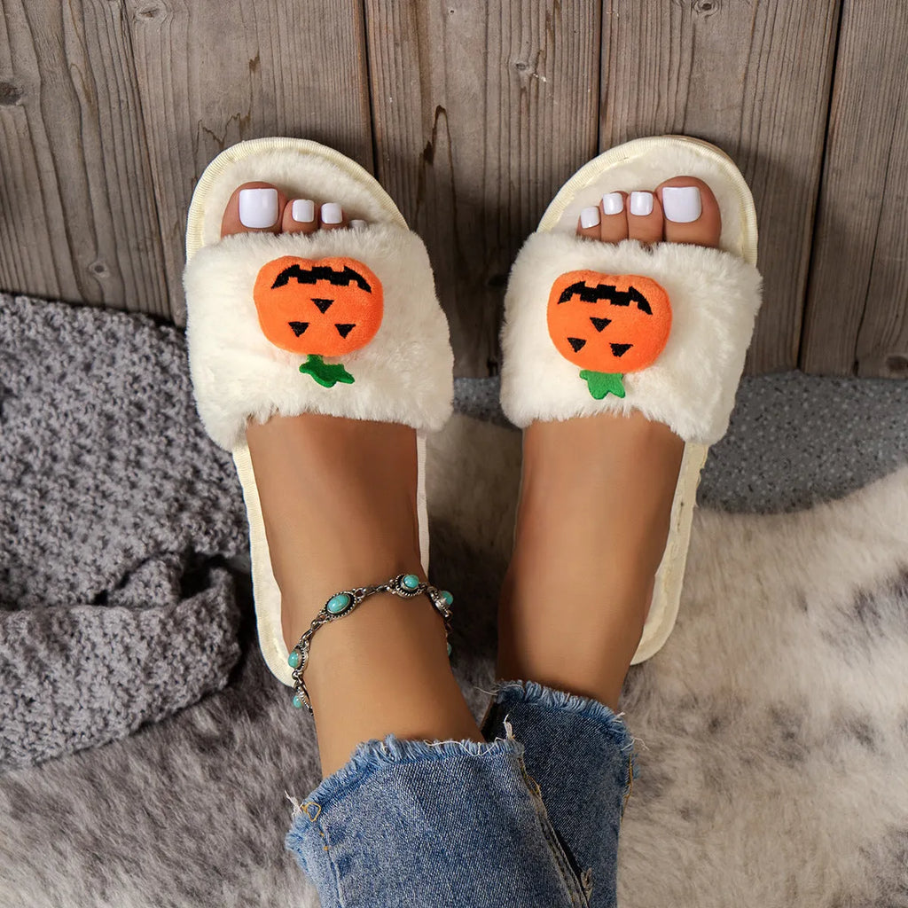 Yellow and white cartoon pumpkin plush slippers with synthetic fur and PVC anti-slip sole.