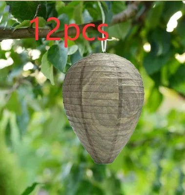 Paper and wire beehive lantern with honeycomb structure, 22 cm wide by 28 cm high.