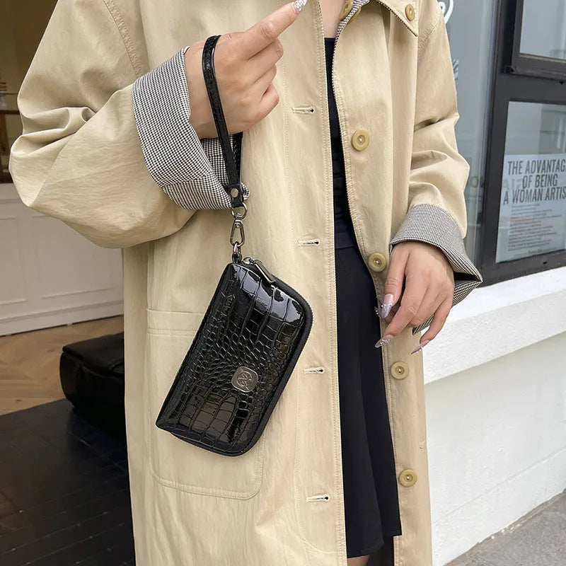 Hand-held Crystal Bamboo Pattern mobile phone bag in black, rectangular shape, 19x5x10cm, PU material, with interior pockets.