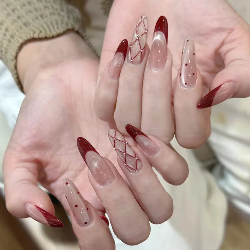 A pack of five pairs of long square-shaped false nails in assorted colours and patterns.