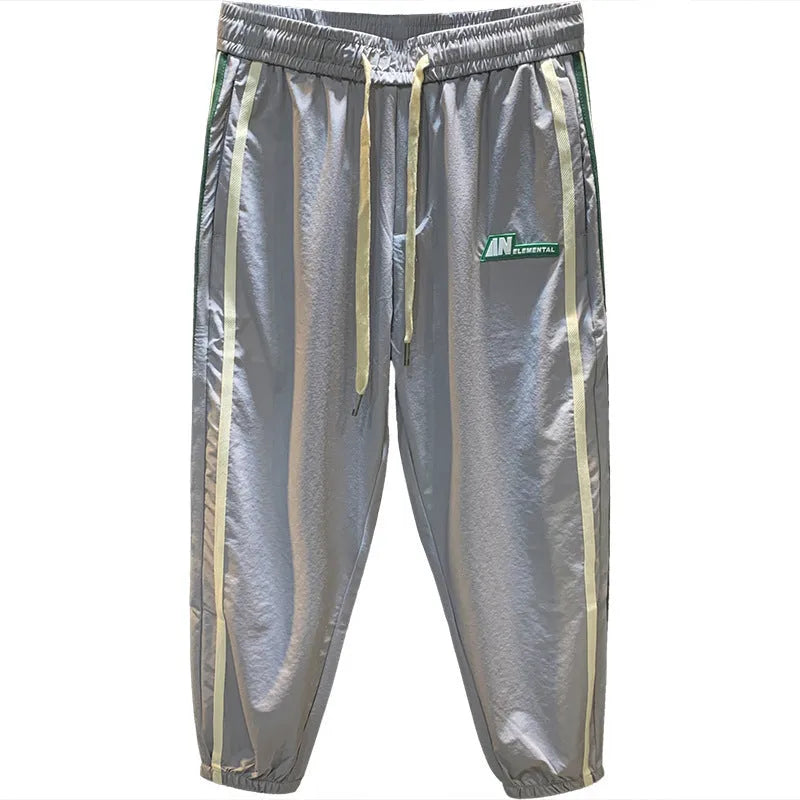 Men's black cotton ice silk harem trousers showing mid-waist design and full-length legs