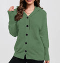 A woman wearing a loose-fit, hooded, solid-colour cotton cardigan sweater in a neutral tone.