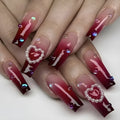 Wine red gradient plaid pattern fake nail tips with pearl heart detailing in ballet style