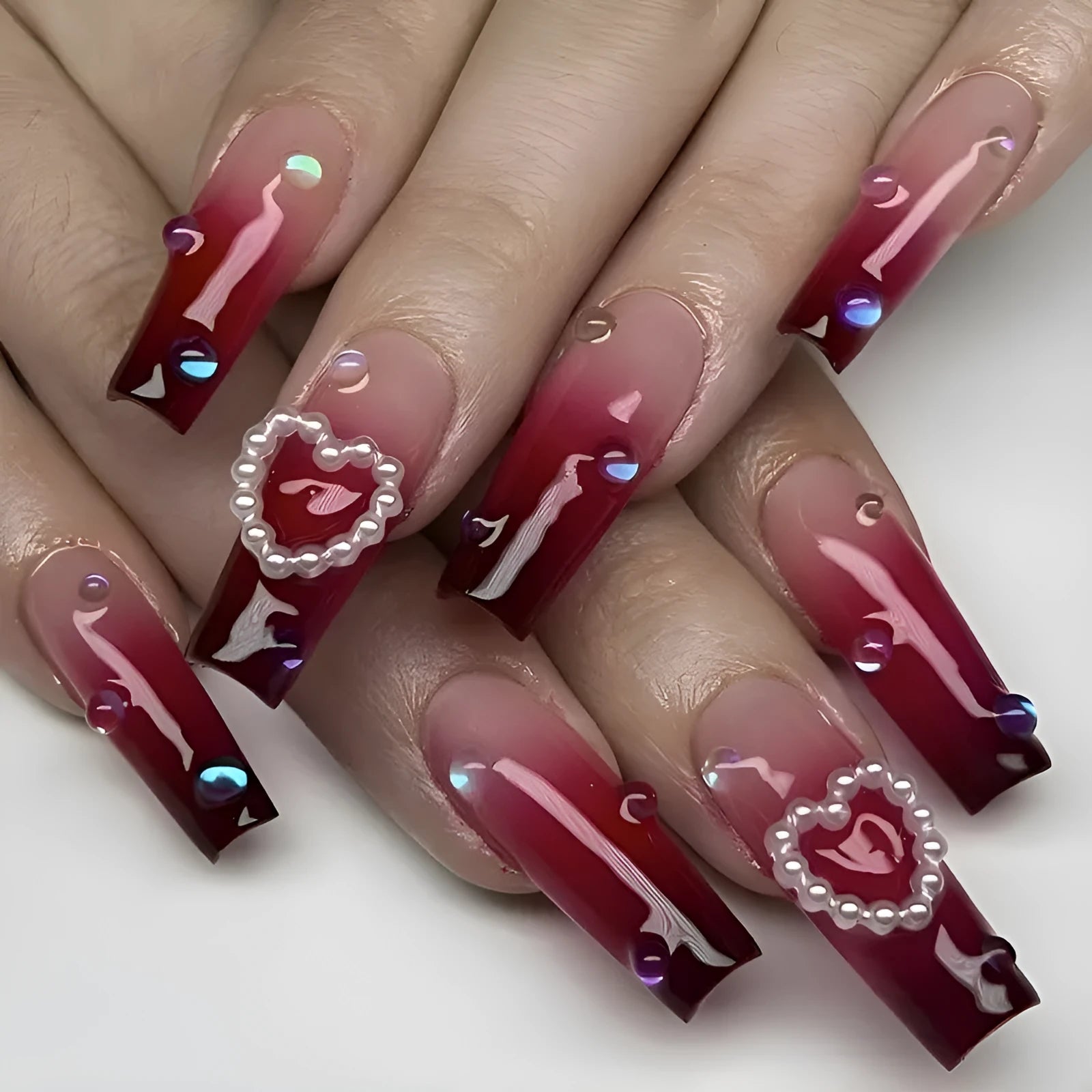 Wine red gradient plaid pattern fake nail tips with pearl heart detailing in ballet style