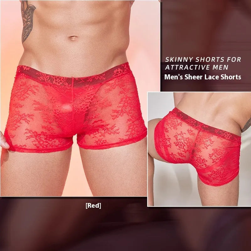 Men's black boxer briefs with white lace trim detail on a grey background.