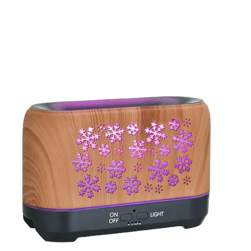 Colourful snowflake wood grain flame effect aromatherapy humidifier diffuser on a desktop with remote control.
