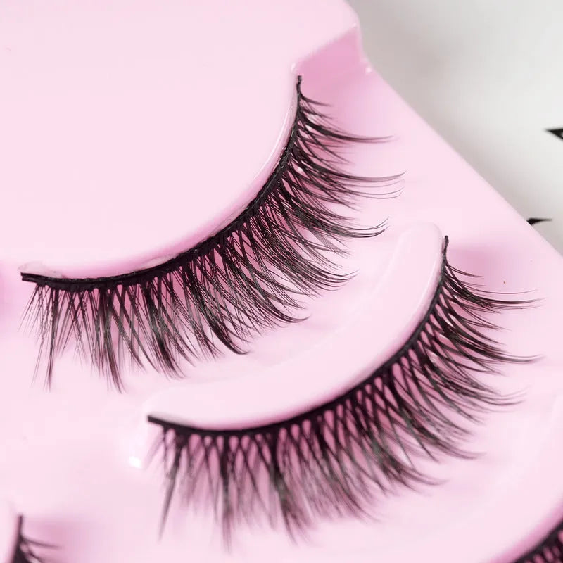 Set of three styles of black manga false eyelashes on plastic packaging