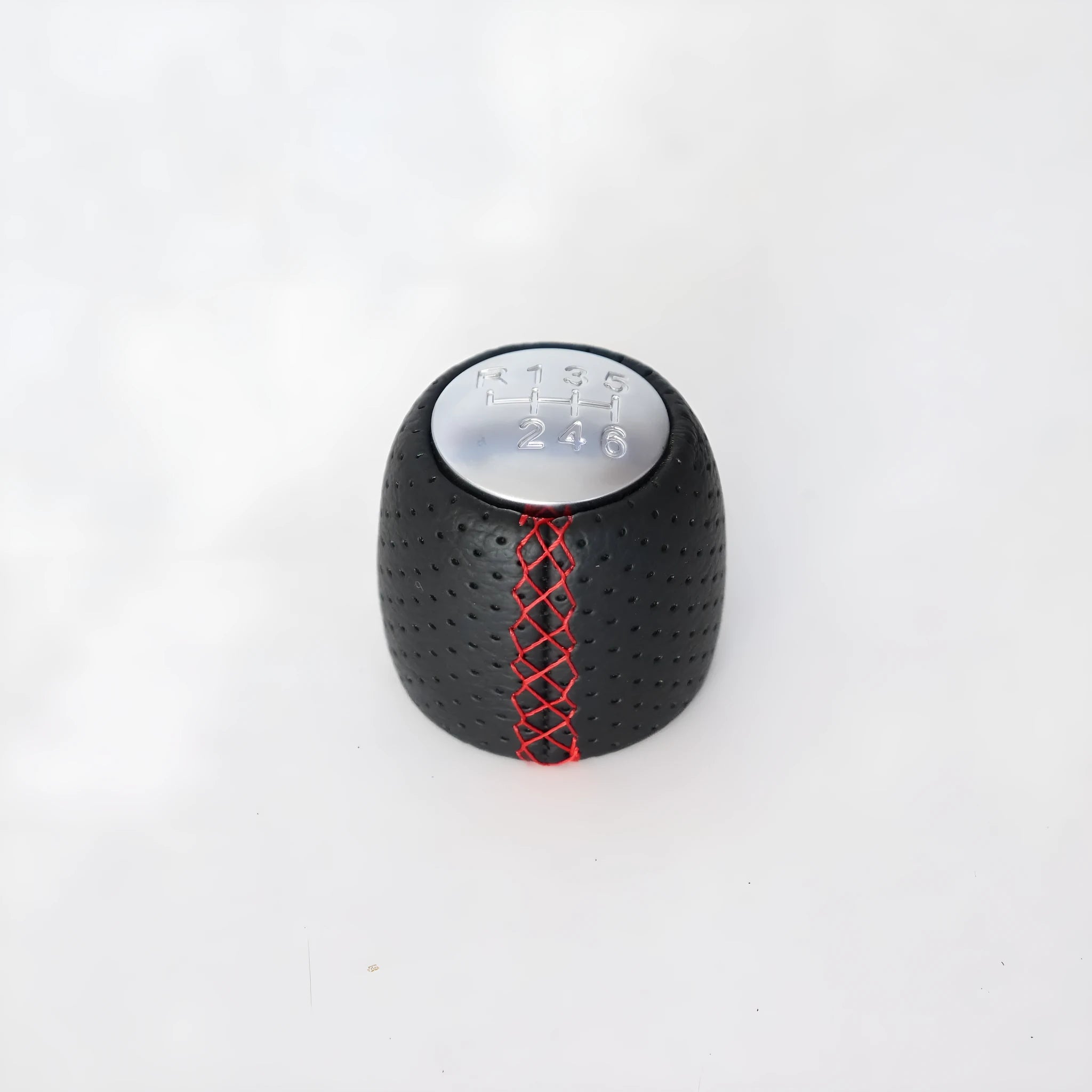 Sewn wrapped perforated leather handball gear for Alpha vehicles in Black, Red, and White Line options.