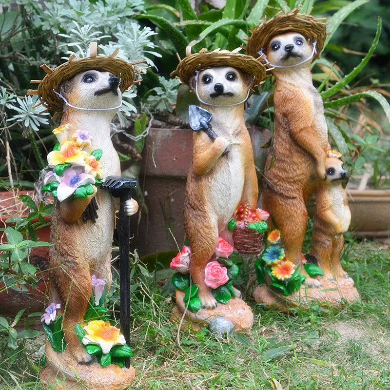 Straw hat wearing mongoose garden ornament in synthetic resin