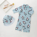 Boys' penguin print long sleeve swimsuit with matching swimming cap set
