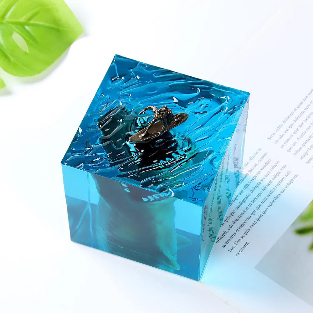Clear epoxy resin ornament with shark surfing on a wave, includes lamp holder.