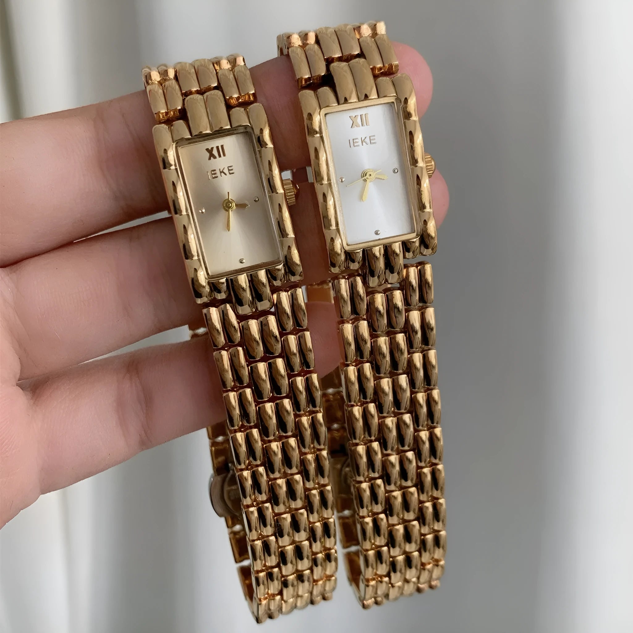 Women's bracelet watch with 15mm dial, spiral crown, and stainless steel strap in gold or silver finish