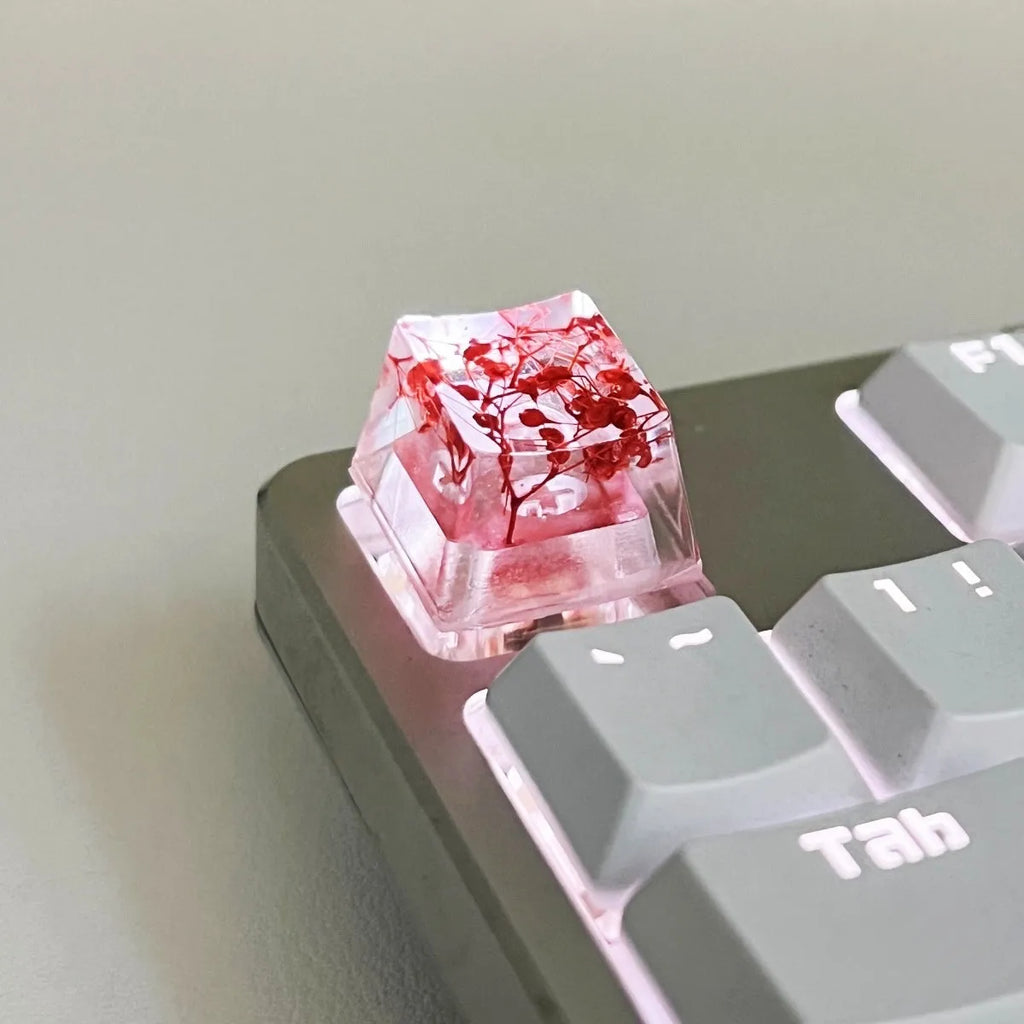 Transparent resin mechanical keyboard keycap with starry sky design in one of four colour options