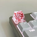 Transparent resin mechanical keyboard keycap with starry sky design in one of four colour options