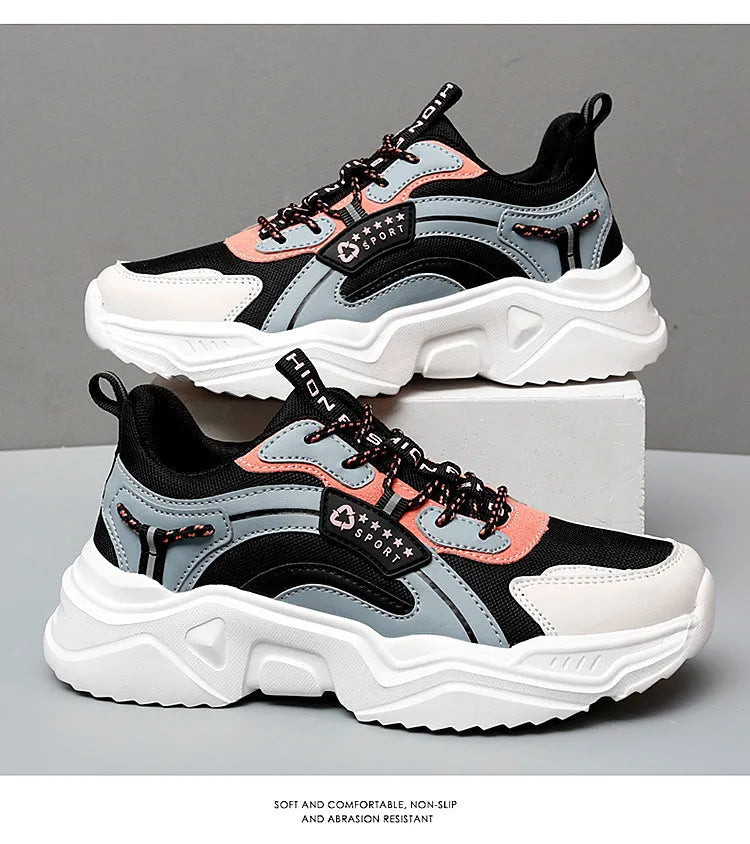 Women's white casual sports shoes with mesh upper, thick PU sole, buckle detail, and round toe.