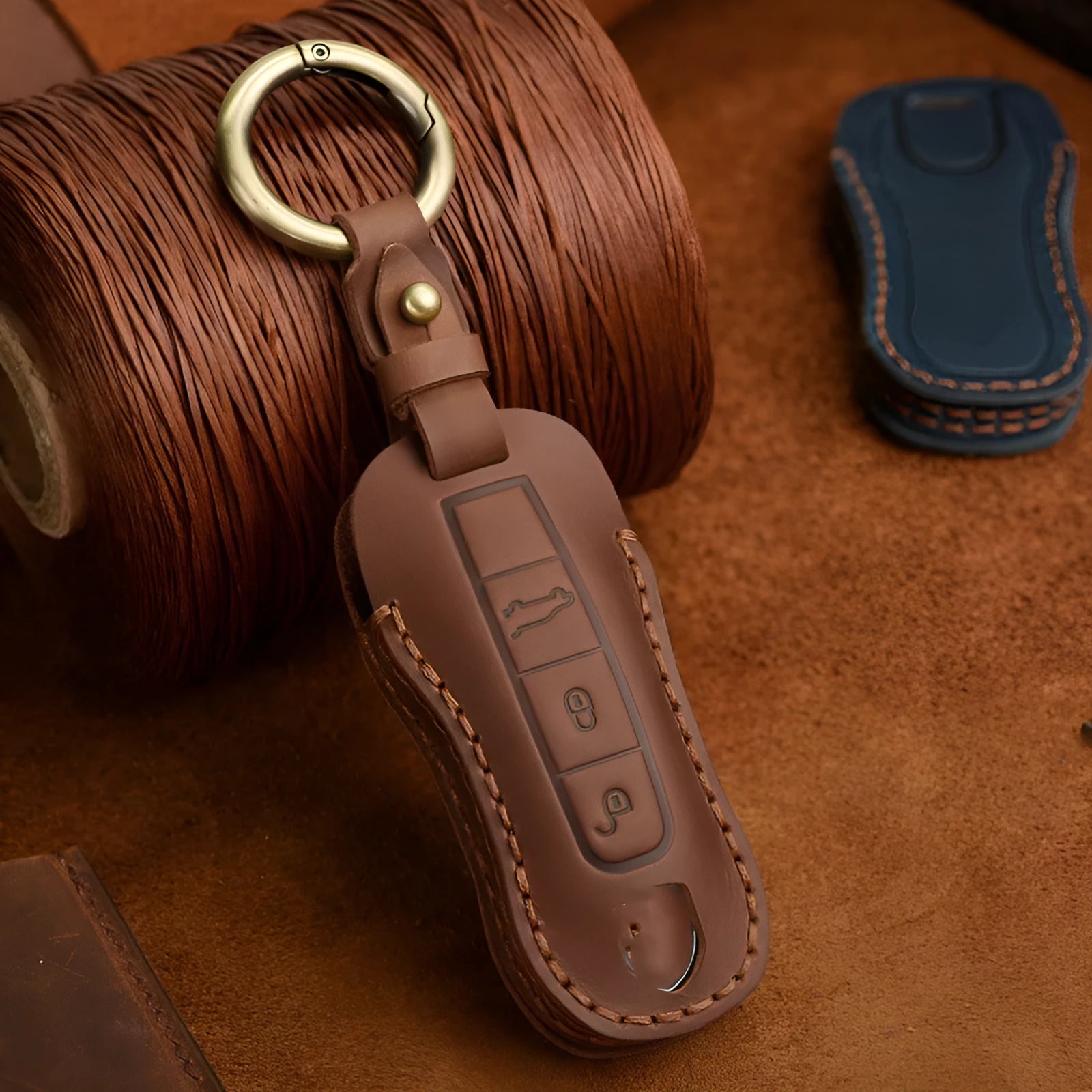 Authentic brown cowhide leather Porsche key case with a retro metal buckle closed