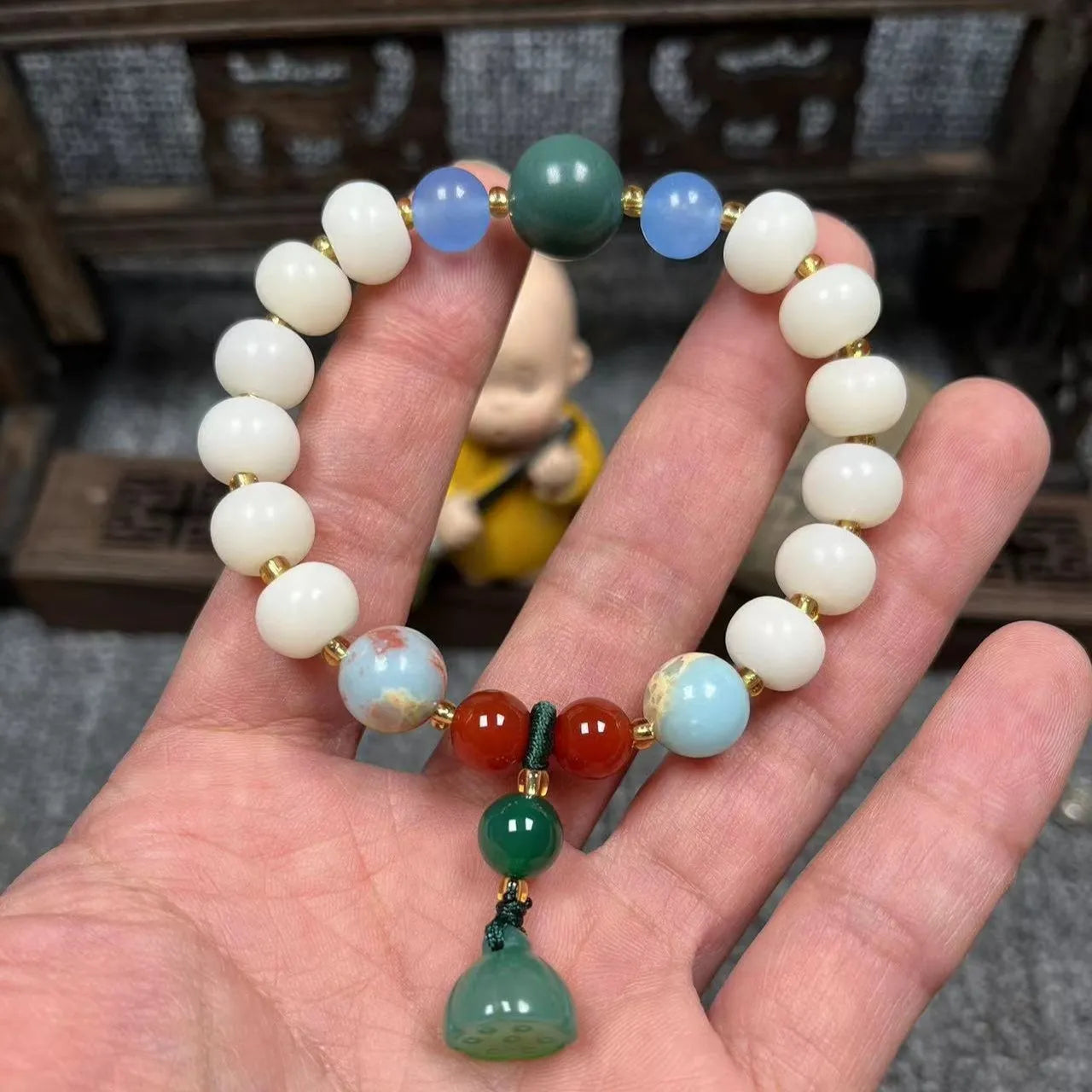 Carved pumpkin lotus Bodhi root bracelet with white jade beads and multiple dimensions